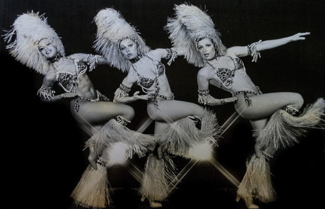 What "The Last Showgirl" Got Right and What It Got Wrong Three dancing cabaret showgirls. Image by Booth Kates from Pixabay.